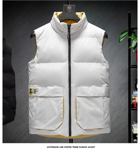 Detail view of white vest featuring contrasting yellow lining and black zipper closure