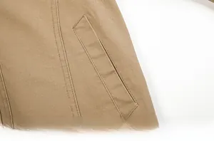 Close-up of khaki cotton jacket pocket with premium double-stitch seam details