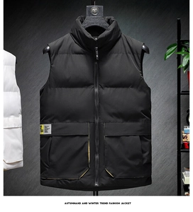 Detail view of black stand collar puffer vest with large pockets and text patch