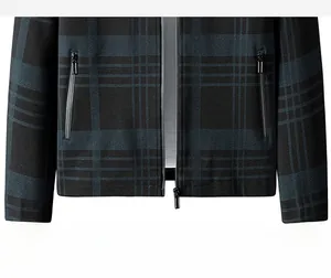 Close-up of men's casual jacket featuring dark plaid pattern and metal zipper pockets