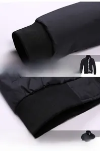 Detail of ribbed cuffs and hem on men's black bomber jacket with neat stitching