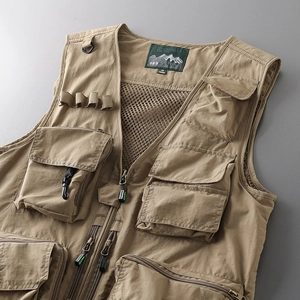 Detail view of khaki tactical vest featuring breathable mesh lining and durable D-ring hooks