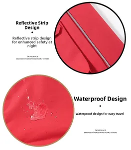 Detail view of waterproof red fabric with silver reflective safety strips and neat stitching