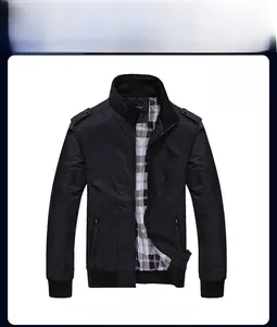 Detail view of black bomber jacket featuring classic stand collar and plaid lining