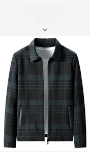 Detailed shot of men's dark green plaid jacket with zipper closure and stand-up collar