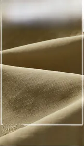 Detailed macro view of khaki twill cotton fabric showing breathable and durable texture