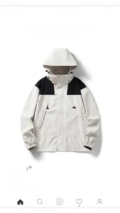 Detail of windproof men's workwear jacket with adjustable drawstring hood and contrast panels