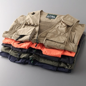 Stack of tactical vests in khaki, orange, green and navy showing multiple utility pockets