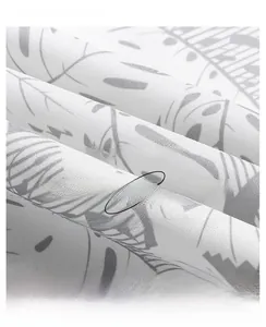 Macro detail of breathable coral velvet fabric with gray leaf pattern and mesh lining