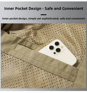 Detail view of the breathable mesh inner pocket of khaki outdoor casual jacket for men