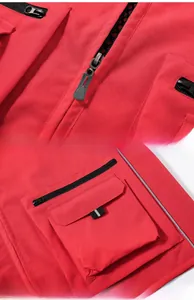 Detail of red utility vest showing smooth metal zipper and 3D pocket with reflective strip