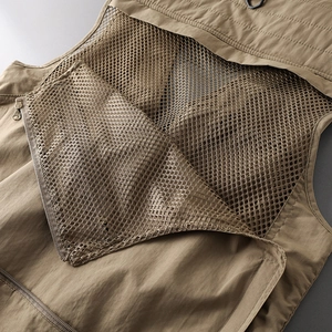 Detail of breathable mesh back and metal ring zipper on khaki tactical outdoor vest