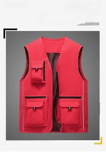 Detail of red outdoor utility vest showing multiple pockets and breathable mesh lining
