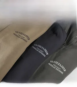 Close-up of fleece lining texture and brand lettering on winter work jackets in three colors