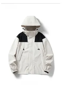 Detailed close-up of hooded outdoor jacket with contrast stitching and velvet collar