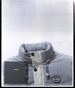 Detail of light gray corduroy vest showing stand collar, black buttons, and drawstring cord