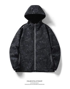 Detail of dark grey leaf pattern jacket with white zipper and reflective shoulder strips