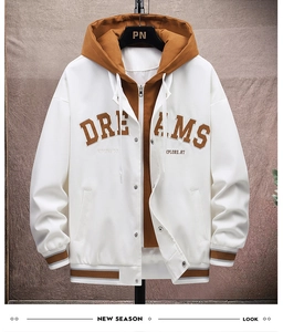 Close-up of color-block jacket with Dreams embroidery and drawstring hood details