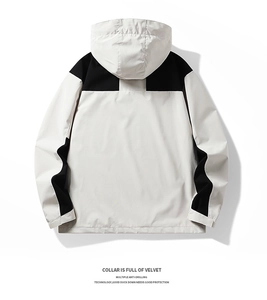 Detail view of water-resistant hooded jacket featuring warm velvet collar and anti-drilling fabric