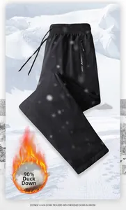 Detail showing 90% duck down filling and waterproof fabric of black winter pants