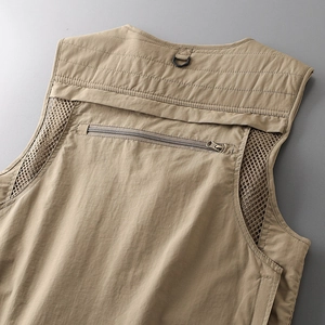 Detail of khaki tactical vest back featuring breathable mesh and functional D-ring