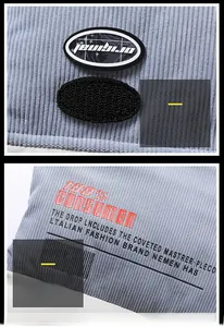 Detail of light blue corduroy vest showing original label and industrial graphic prints
