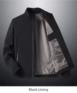 Detail view of men's black stand collar jacket with grey plaid lining and metal zipper