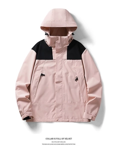 Detail of hooded outdoor jacket with pink and black contrast, down filling and velcro cuffs