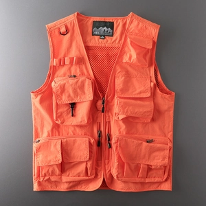 Detail view of bright orange tactical vest featuring multiple utility pockets and D-ring