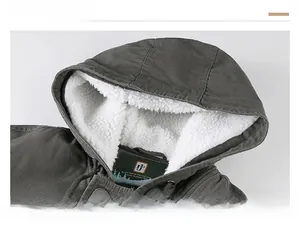 Detail of hooded jacket showing warm white sherpa fleece lining and windproof drawstring