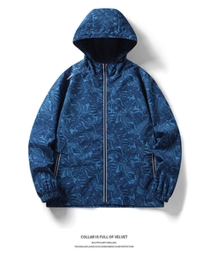 Detail of navy blue hooded jacket featuring tropical leaf pattern and velvet lined collar