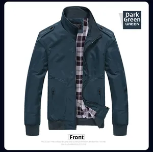 Detail view of a dark green stand collar jacket featuring plaid lining and ribbed cuffs
