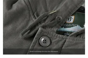 Macro detail of men's winter jacket showing thick fabric texture and metallic buttons