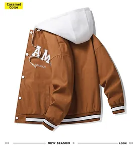 Detailed view of caramel jacket with white hood, AM lettering and striped ribbing cuffs