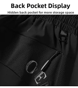 Detail view of black ice silk pants showing D-ring buckle and breathable mesh zipper pocket