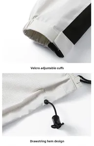 Detail of adjustable velcro cuffs and drawstring hem with breathable mesh lining