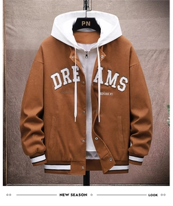 Detail of Dreams embroidery and metal snap buttons on a brown hooded baseball jacket