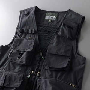 Detail of tactical vest showing multi-pocket design and durable nylon fabric texture