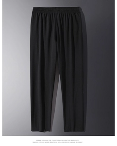 Close-up of elastic waistband on men's casual black trousers with smooth texture
