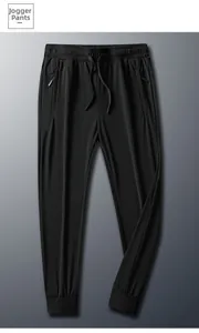 Detail of men's black ice silk joggers featuring elastic drawstring waist and zipper pockets