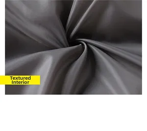 Close-up of textured dark grey satin lining with smooth finish for winter jacket