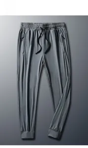 Detailed view of men's quick-dry ice silk joggers with drawstring waist and zipper pockets