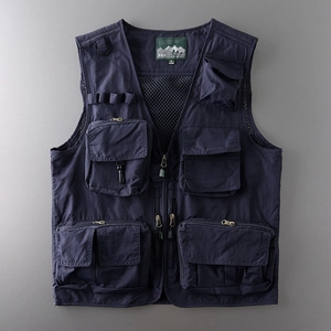 Detail of navy blue tactical vest with six functional pockets and breathable mesh lining