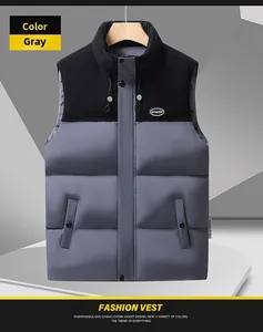 Detail of gray men's puffer vest showing stand-up collar and black shoulder patchwork