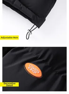 Detail des verstellbaren Saums mit orangefarbenem Etikett auf der schwarzen Winterjacke