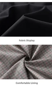 Macro detail of black plain outer fabric and grey plaid lining with pink geometric lines