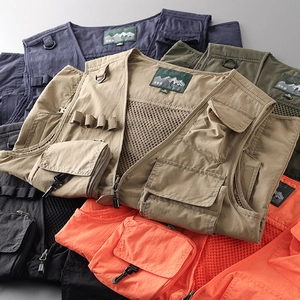 Detail view of multi-pocket tactical vests in various colors with mesh lining and D-rings