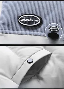 Detail of light blue corduroy fabric with oval velcro patch and matte metal snap button