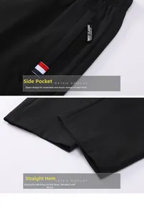 Detail of men's black sports pants featuring side zipper pocket and tricolor stripe tape