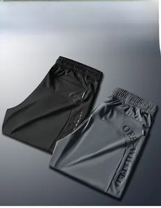 Detail showing elastic waistband, D-ring and breathable mesh panels on casual pants